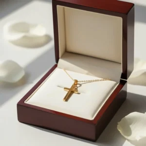 The beautiful 18k gold cross necklace presented in a premium jeweler's gift box, ready for giving.