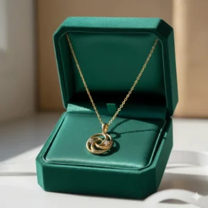 An 18k gold necklace presented in a luxury velvet gift box, perfect for an anniversary or birthday present.