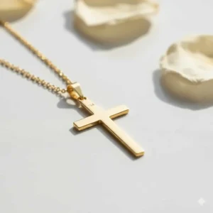 Detailed close-up of the finely crafted 18k gold cross pendant, highlighting its polished finish.