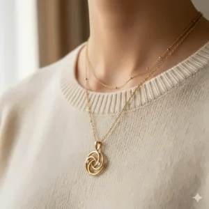 Model wearing two 18k gold necklaces layered for a stylish and elegant everyday look.