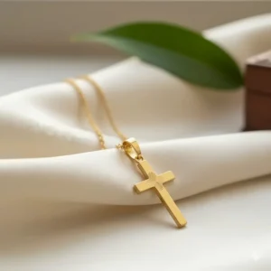 Detailed side profile of the 24k gold cross necklace pendant showing the intricate design.