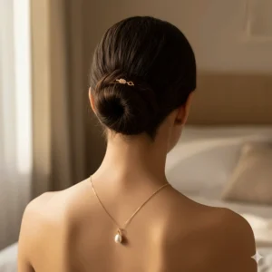 Image demonstrating the length and how the 14k gold pearl necklace chain drapes and shines against the skin.