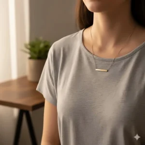 Minimalist 14k gold bar pendant necklace worn with a simple outfit for elegant everyday wear.