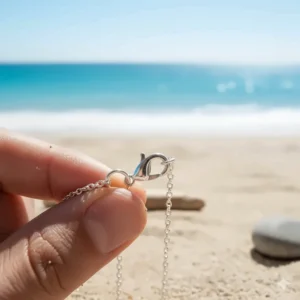 Close-up of the necklace's chain and secure clasp, emphasizing the adjustable length and durability of the rolo or cable chain used.