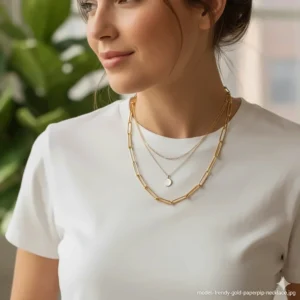 Layered necklace stack featuring the gold paperclip chain necklace with a complementary delicate gold pendant for a chic, trendy look.