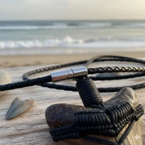 Close-up detail of the durable stainless steel clasp and secure braided rope used to craft this handcrafted megalodon tooth necklace.