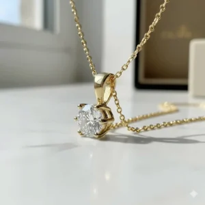 Profile and back view of the diamond solitaire pendant, highlighting the craftsmanship of the 14k gold bail.