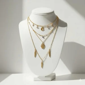 Bohemian-inspired gold necklace layering set with celestial moon and star charms.