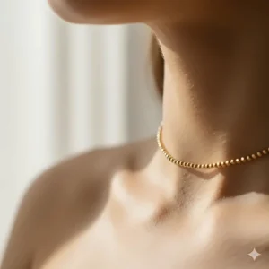 A thin gold choker used as the foundation for everyday necklace gold layering.