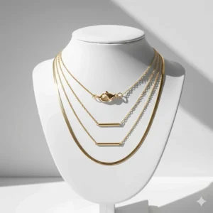 Close-up illustration of a gold necklace layering set attached to a multi-strand tangle-free spacer clasp.