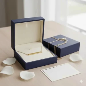 The personalized gold engraved bar necklace presented beautifully in a sleek, branded jewelry gift box.
