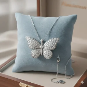 An elegant butterfly-shaped necklace in 18k white gold featuring brilliant-cut diamonds.